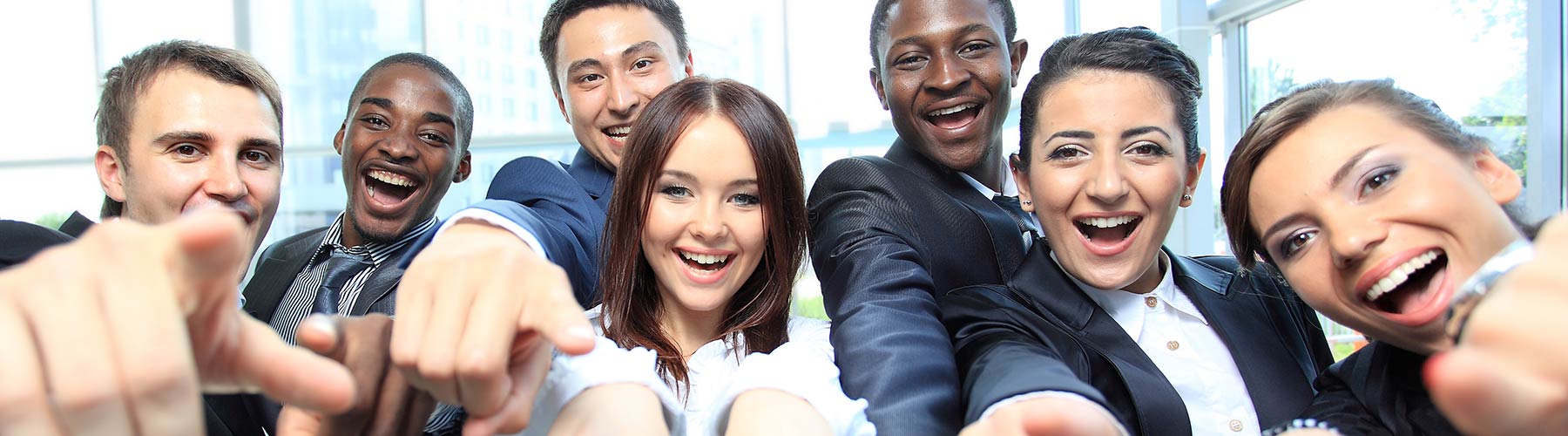 group of business people pointing at the camera